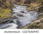 Long Exposure Of Rapids With Trees
