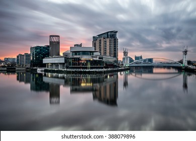 Long exposure at Salford Quays on a calm morning with beautiful sunrise and clear reflections.