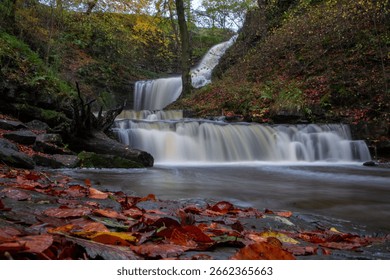 A long exposure of the Scaleber Force waterfall flowing down a beautiful hill in United Kingdom