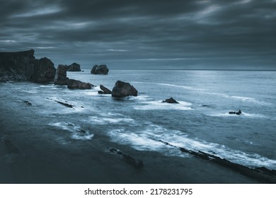 Long Exposure Seascape At Dusk. Moody Beach Scenery At Night. Summer Beach Landscape In Dark Tones. Rocky Beach Wallpaper.