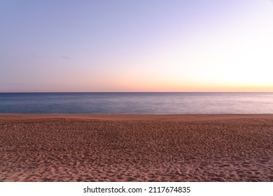 long exposure shot of sandy beach at sunset, empty beach  - Shutterstock ID 2117674835