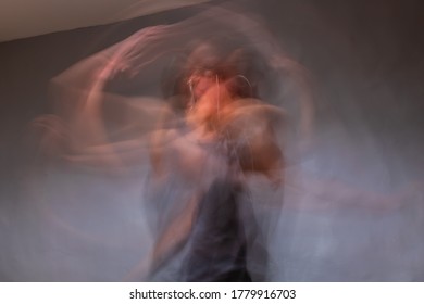 A Long Exposure Shot Of An Unrecognizable Young Caucasian Woman Dancing In Her Room