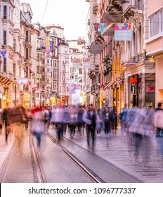 Long exposure or slow shutter speed and blurred image:Unidentified people walk at Istiklal street,popular destination in Istanbul,Turkey.29 April 2018