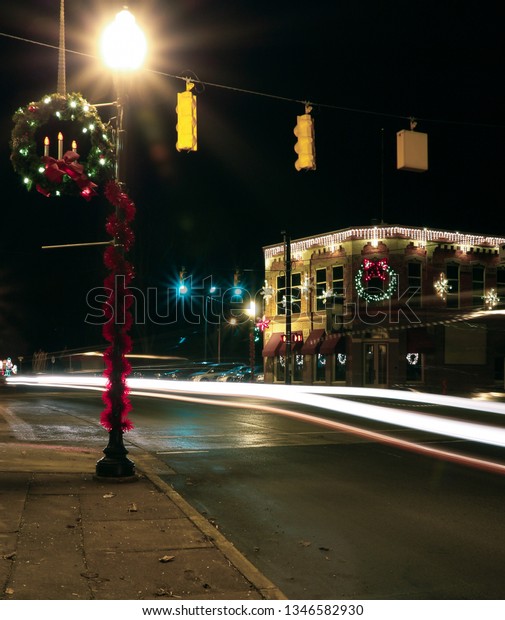 A long\
exposure of a small-town American American city - Vassar, MI - on\
Thanksgiving day with Christmas Decorations.\
