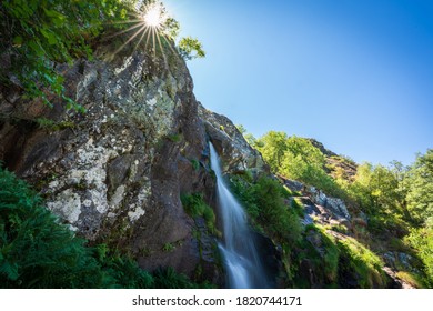 Long exposure of Sotillo waterfall in Sanabria with starry sun and text space