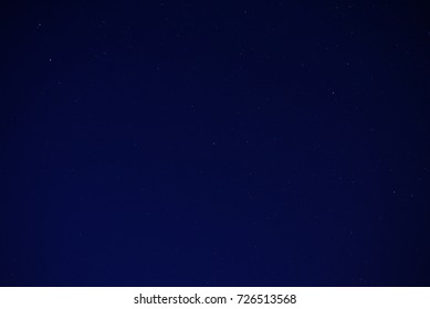 Long exposure of stars in the night sky with copyspace area for astronomy based designs and backgrounds