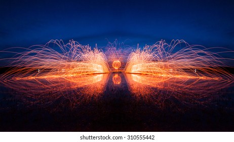 Long exposure of steel wool lighting on twilight time with blue sky background - Powered by Shutterstock