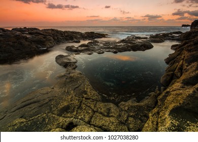 Long Exposure sunrise, colorful sky, volcanic rock beautiful seascape at Gran Canaria Island Coast in Spain. - Shutterstock ID 1027038280