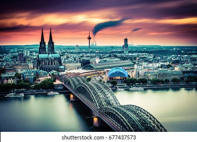 long exposure Sunset moving clouds over the city Cologne Germany ,Evening scene over Cologne/Koln city with Kolner Dom/Cathedral behind the Hohenzollern bridge and Koln towers,Beautiful colorful  - Shutterstock ID 677437573