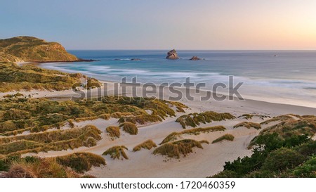 Long exposure sunset at Sandfly Bay beach, Dunedin, New Zealand