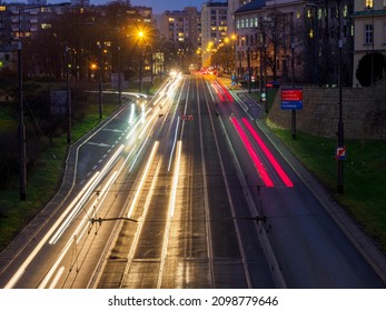 long exposure time, street in the evening seen from above, long lights of cars and trams, light drawing Warsaw December 2020