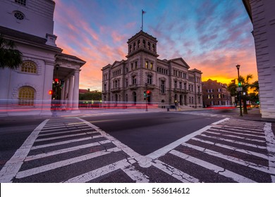 Long exposure of traffic at the Four Corners at sunset, in Charleston, South Carolina.