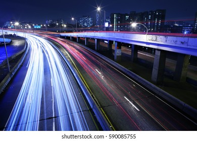 Long Exposure Of Traffic Light Trails On A City Street.