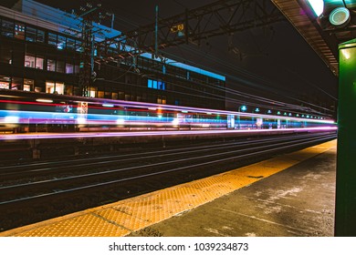 Long Exposure Of A Train Speeding Through A Station.