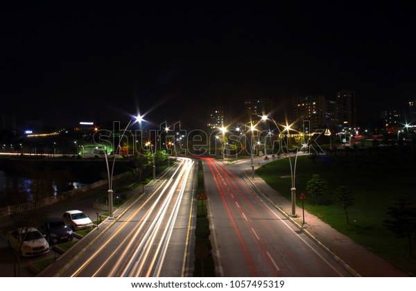 Long exposure,\
vehicle lights and city\
lights