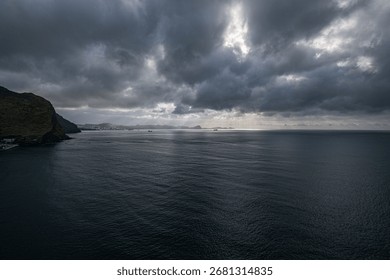 A long exposure view of dramatic cloudy sky over the sea, Madeira coast, Portugal