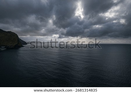 A long exposure view of dramatic cloudy sky over the sea, Madeira coast, Portugal