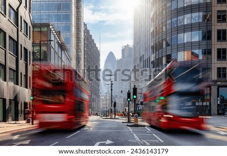 Long exposure view of Liverpool Street in the City with bus traffic and office skyscrapers in the background