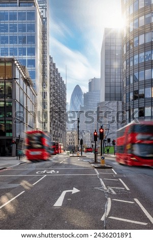 Long exposure view of Liverpool Street in the City with bus traffic and office skyscrapers in the background