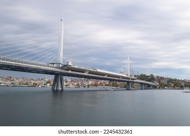 Long exposure. View of Haliç Metro Bridge connecting Azapkapı (Beyoğlu) and Unkapanı (Fatih) (Halic Metro Bridge). blue sky Istanbul Turkey - Shutterstock ID 2245432361