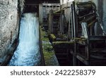 Long exposure of water flowing through abanoned mill shafts in Tata, Hungary. Abanoned water mill.
