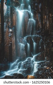 Long Exposure Of Water Running Down A Wall