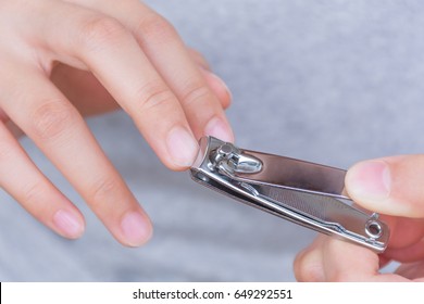 Long finger nails and dirty. It's time to cut with a nail clipper. - Shutterstock ID 649292551