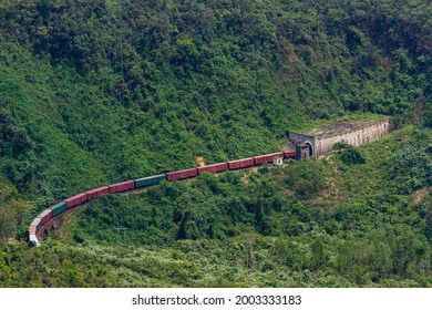 A Long Freight Train Entering Tunnel In Hai Van Pass, Vietnam