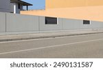 Long gray concrete fence with black metallic panels. Orange plaster wall on behind, cement sidewalk and city street in front. Background for copy space.