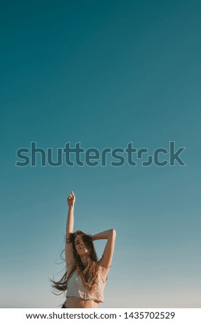 Image, Stock Photo Tattooed woman in front of a painted wall