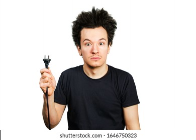 Long Hair Guy Holds An Electric Plug With A Cable In His Hand On A White Isolated Background.