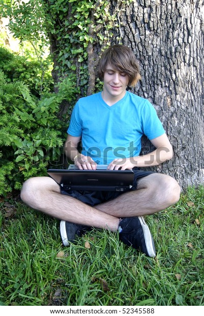 Long Hair Teen Boy Laptop Sitting 库存照片 立即编辑