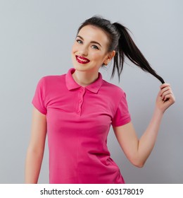 Long Haired Woman In Pink Polo. Portrait