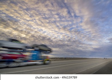 Long haul truck driver rides into the sunset