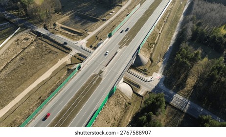Long highway cutting through forest
