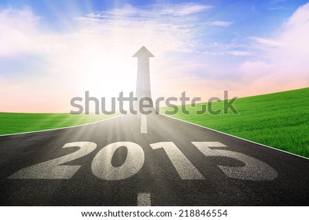 The long highway with upward arrow to the sky, symbolizing the way to better future 2015