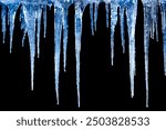 Long icicles on black isolated background