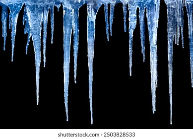 Long icicles on black isolated background