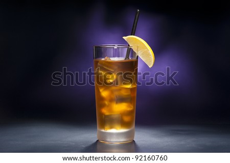 Long Island Iced tea in front of purple background