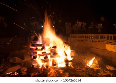 Long Island, New York - September 20 2008: A Group Of Young People Standing Around The Campfire And Sing During A Church Retreat.