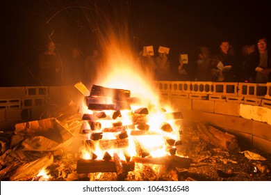 Long Island, New York - September 20 2008: A Group Of Young People Standing Around The Campfire And Sing During A Church Retreat.