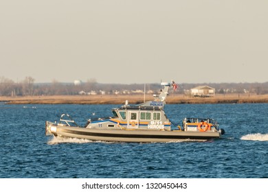 Long Island, New York USA - February 21, 2019 : A Nassau County Police Marine Patrol Boat Patrols The Waterways Of South Nassau County.  