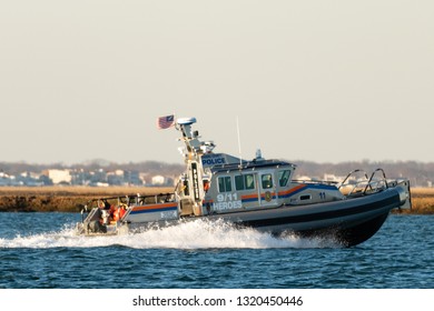 Long Island, New York USA - February 21, 2019 : A Nassau County Police Marine Patrol Boat Patrols The Waterways Of South Nassau County.  