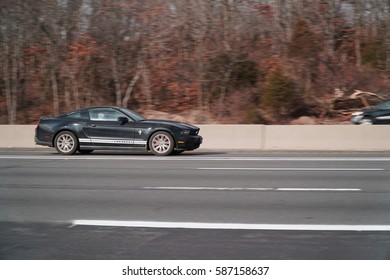 Long Island, NY - Circa 2017: Ford Mustang Driving Fast On A Highway. Motion Blur Vehicle In Carpool Lane Of Expressway. Original Concept Sports Car Manufactured In America By Motor Company.