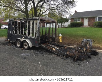 Long Island, NY - Circa 2017: Landscaping Equipment Trailer Remains Destroyed After Fire Damages Lawn Mower Equipment Outside A Residential Home In New York.