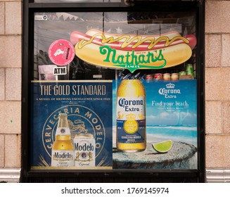 Long Island, NY, USA-July 3,2020 A Group Of Advertisements On The Window Of A Bodega 