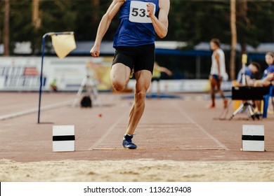 long jump men athlete jump in athletics competition - Powered by Shutterstock