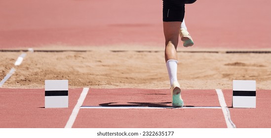 Long jump men athlete jump in athletics competition, sportsman landing his leg on board before taking off in long jump or triple jump - Powered by Shutterstock