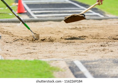 Long Jump Sand Pit Being Raked