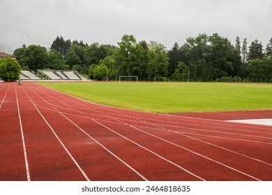 Long jump sand pit and track and field lines in stadium